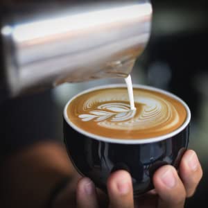 Pouring latte art into cup