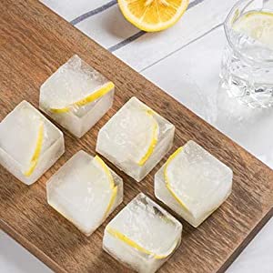 ice cubes with lemons inside for cocktails, cola and so on